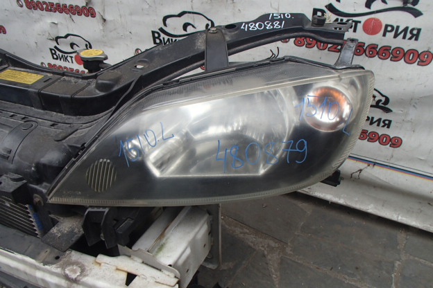 Фара левая
 Mazda
 Demio
 2003 г.в.,
                                кузов: DY3W; двигатель: ZJ-VE;